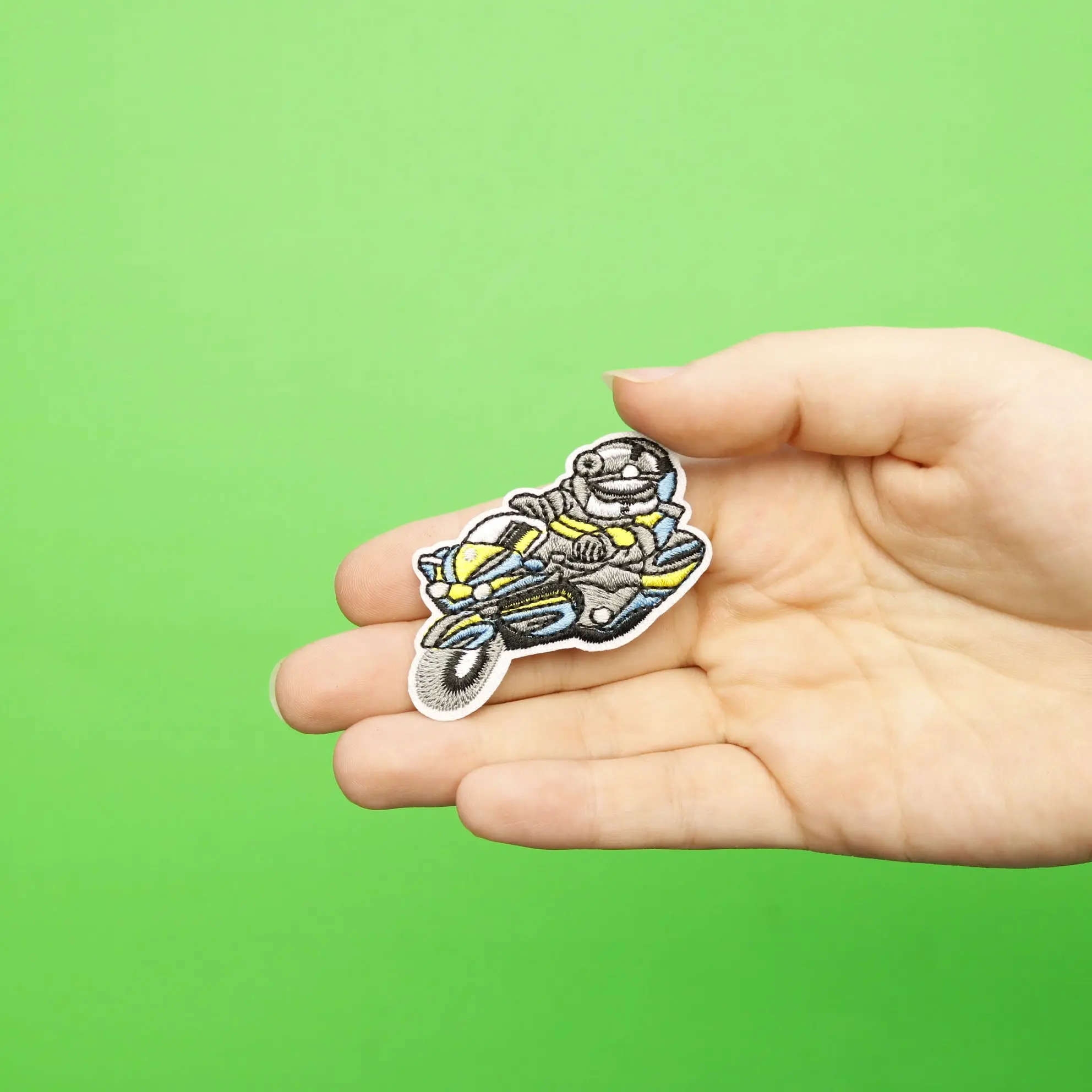Small Astronaut On A Motorcycle Embroidered Iron On Patch - Image 2